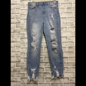 Blue ripped jeans . Size 9 .
